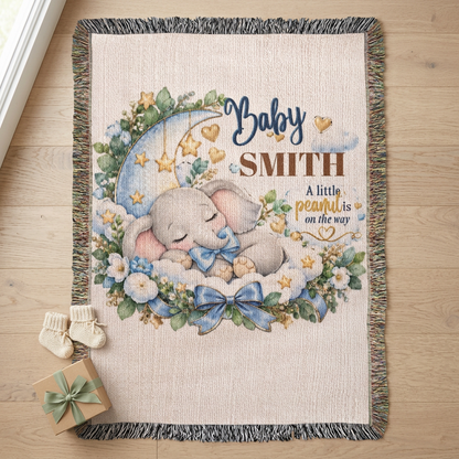 Blue elephant blanket with baby booties and a wrapped gift