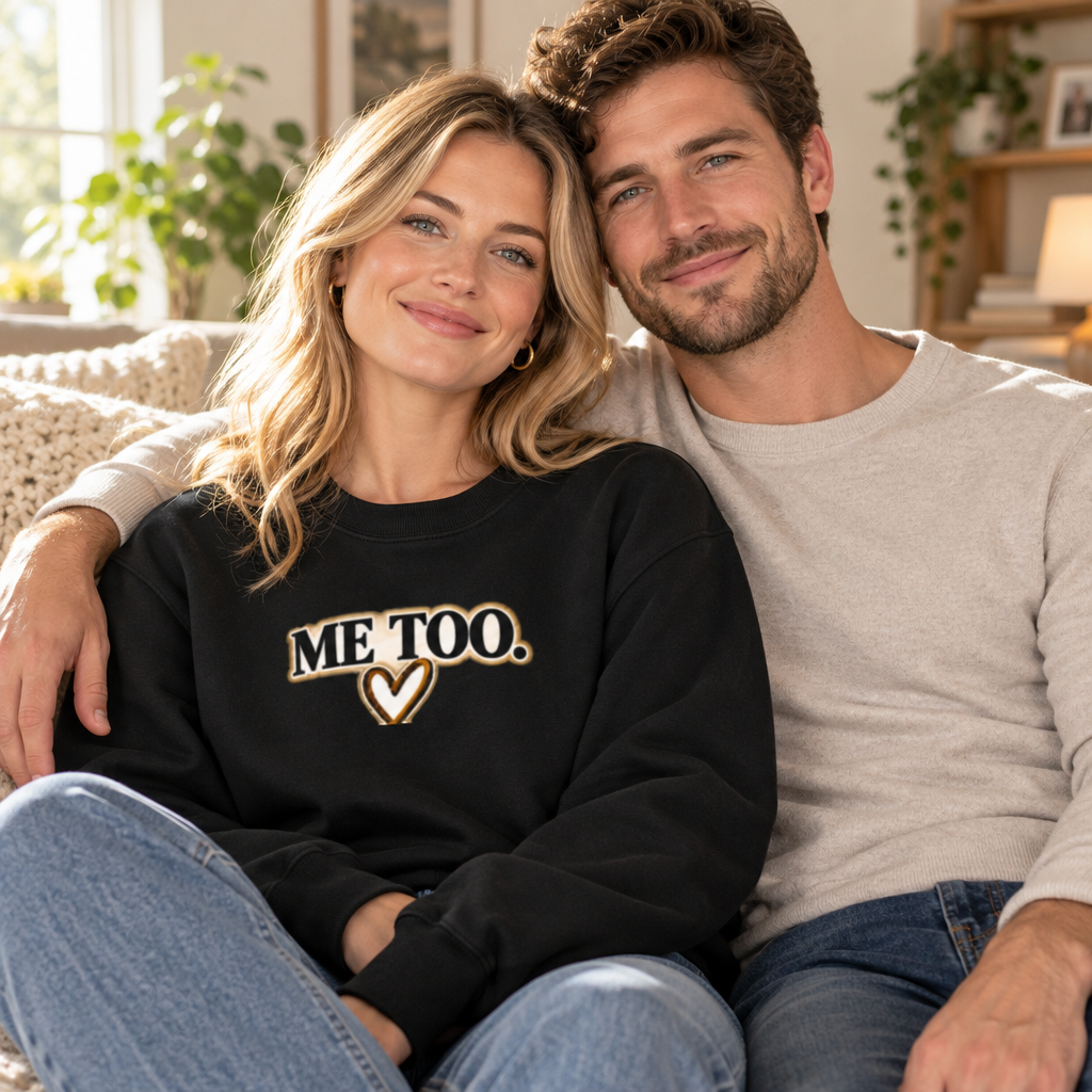 Woman wearing black Me Too sweatshirt with partner at home