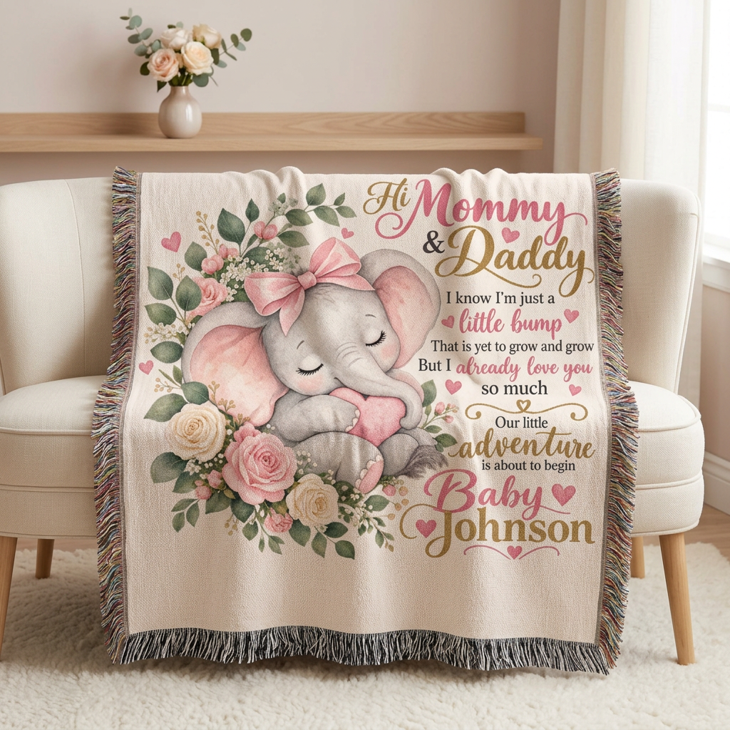 Pink elephant blanket styled in a blush nursery